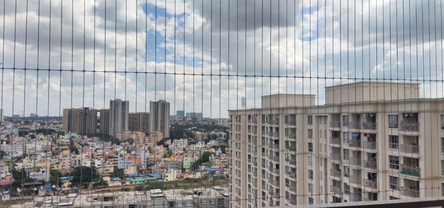 Safety net installation on a residential building in Mumbai